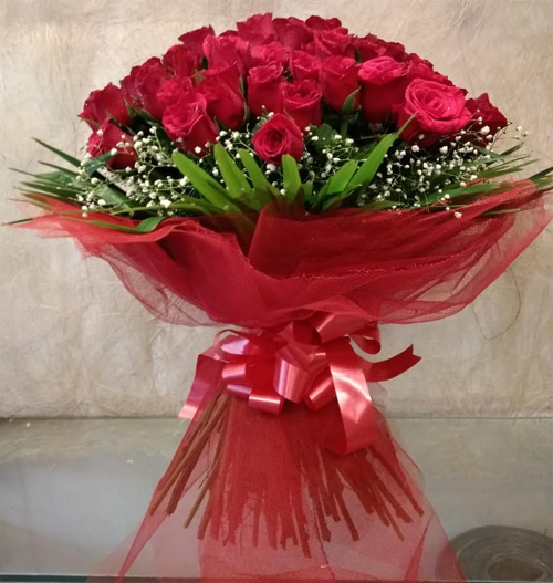 Bouquet of 50 Red Rose in Net Packing cake delivery Delhi