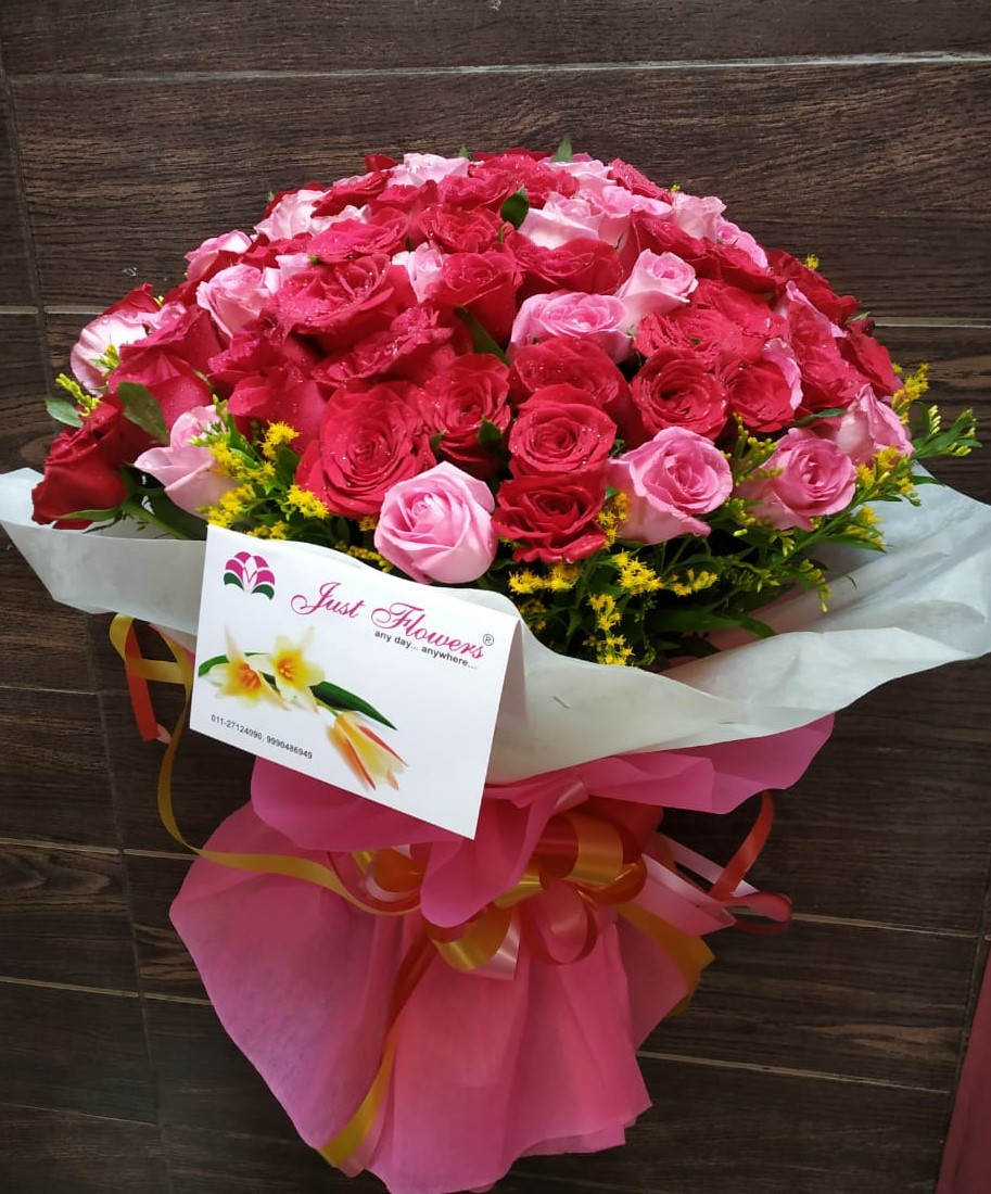 Pink Roses in Wrapped  cake delivery Delhi